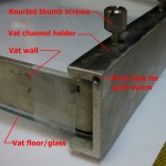 The Vat channel holder ,The thumb screws are for VAT removal and cleaning. The glass bottom is just taped on for now. I think I have finally figured out the  silicone surfacing technique.I can get it  down to a few microns thick with excellent adhesion to the glass.Hope it will provide a good hydrophobic surface on the vat floor for the resin.I am using pure 100% clear using silicone for now. Optical aberration and refraction and  UV filtering is my main concern at this point. The layer thickness of the silicone is probably 5 to 10 microns. I will also post a short video on the technique.